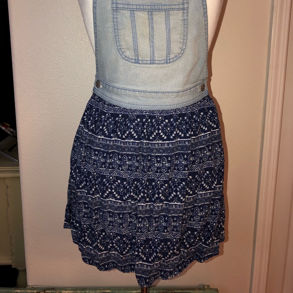 A blue overall dress